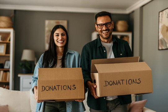 Supportive husband and wife working together to declutter and give back to the community