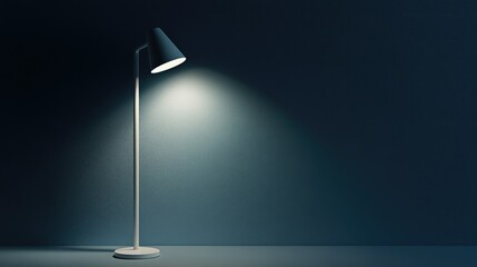 A small, modern reading lamp casting light onto a dark bedroom wall.