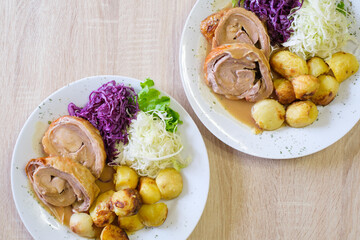 Roasted meat with potatoes and cabbage