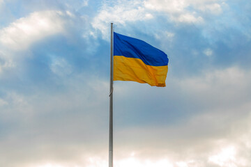 blue yellow flag Ukraine independence concept sign on dramatic cloudscape background