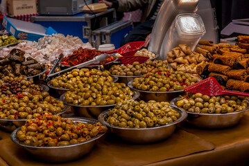Variety of Olives and Mediterranean Delicacies at a London Market Stall