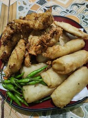 Indonesian food fried bakwan and delicious risol with some chili on the side