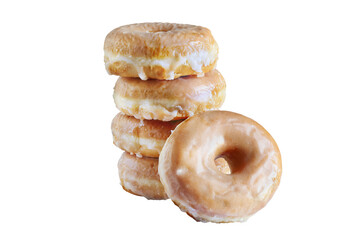 Tall stacked of glazed donuts isolated over a white background with clipping path included..
