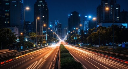 Fototapeta premium City roads glowing under bright traffic lights at night