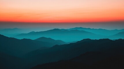 Fototapeta premium Serene Sunset Over Layered Mountain Ranges