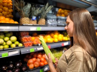 Vegetables, woman grocery shopping at shelf in store, supermarket. Woman grocery shopping