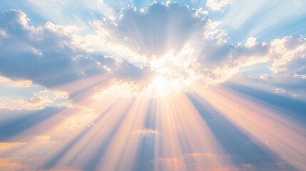Fototapeta premium Bright sunlight piercing through scattered clouds in a blue sky, casting radiant beams of light and creating a majestic celestial view.
