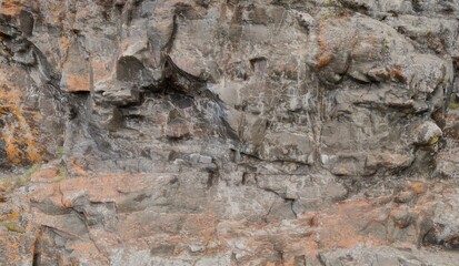 Rugged cliff face texture, coastal rock formation, ocean background, geological detail, design element