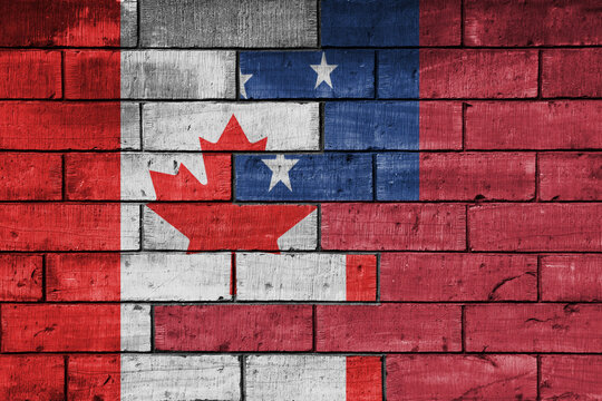 colourful painted big flag of canada and flag of Samoa on a massive old brick wall background. concept