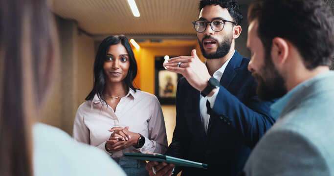 Discussion, tablet or business people in lobby for project or schedule update in conference hall. Leader, employees or keynote speaker with staff in meeting for networking, seminar or event review