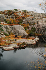 Serene Autumn Landscape with Rocky Cliffs and Water