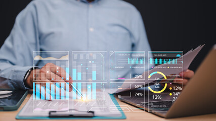 Analyzing Data Trends with Interactive Dashboards, Professional reviews financial reports, using overlay graphs and data visualizations to interpret key metrics and enhance decision-making strategies