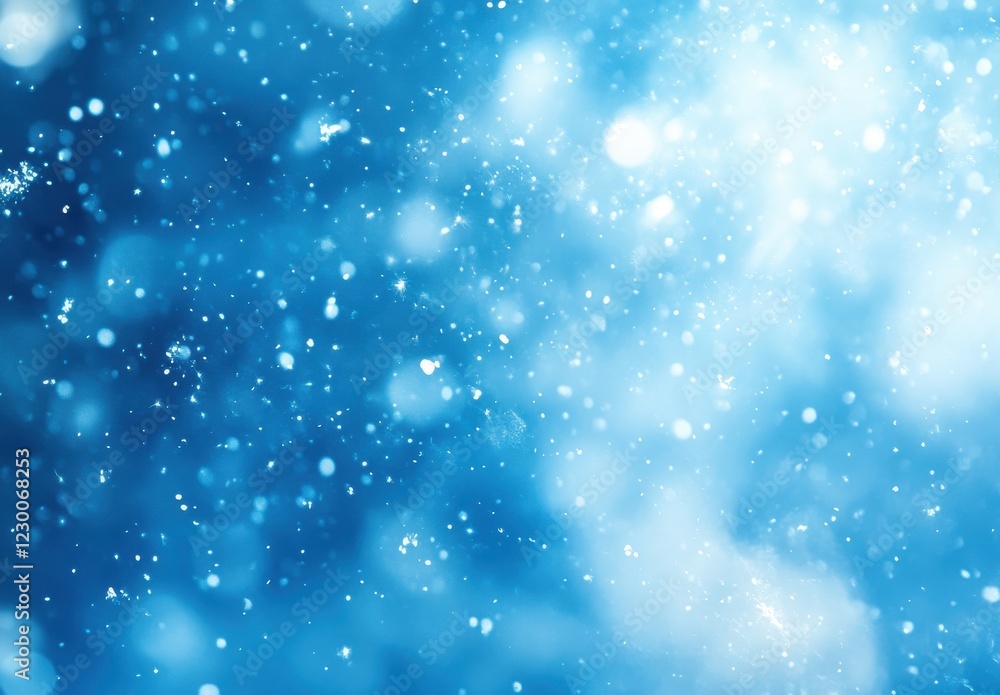 Poster sparkling snowflakes in a beautiful blue winter wonderland with soft bokeh background creating a dre