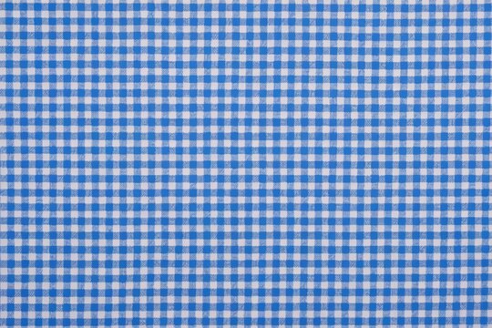 a close up of a blue and white checkered fabric