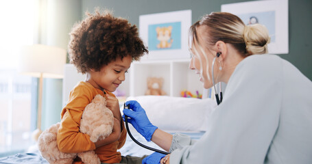 Kid, doctor and stethoscope for healthcare exam, heart check up and cardiology in clinic....