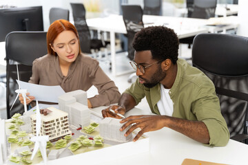 Two colleagues working in the office on a new sustainable project