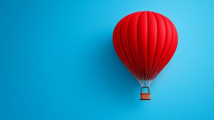 Obraz premium Red Hot Air Balloon Soaring: A vibrant red hot air balloon with a wicker basket ascends against a serene blue sky, symbolizing aspirations, adventure, and the pursuit of dreams. 