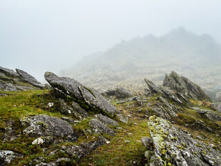 Beautiful rocky landscape under the fog at Cerro Champaqui in Cordoba, Argentina.