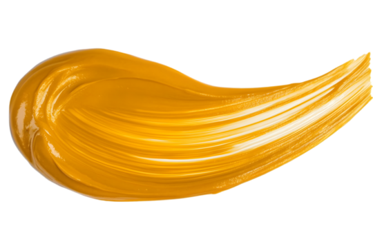 Vibrant mango puree brush stroke creates a bold artistic expression on a plain background in a studio setting