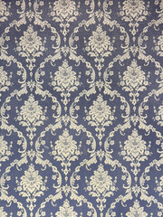 Wallpaper in classic baroque floral ornamental engraving pattern, in gold and blue color. European classic random ornamental seamless background texture.