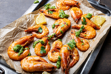  Fried shrimps with lemon and green on a metal tray