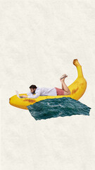 Surfing the internet. Businessman lying on giant banana floating in ocean, working on laptop....