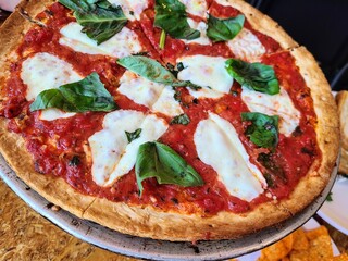Authentic Margherita Pizza Close-Up in Cozy Restaurant Setting