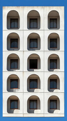 Obraz premium Arched-window building, sunny day, minimal design, architecture stock photo