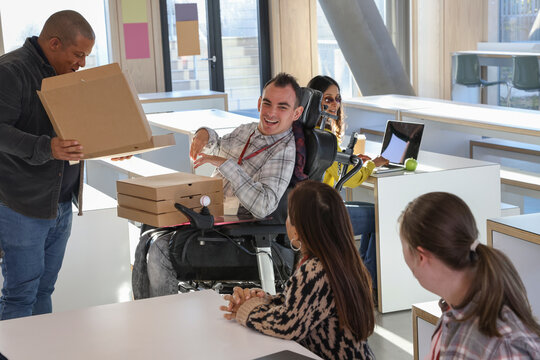 Disabled people enjoying pizza