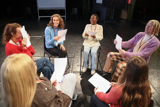Friends talking during rehearsal