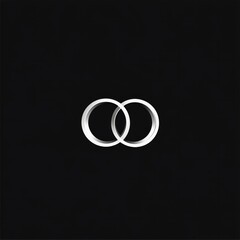 Two interlocking white rings on minimalist black background