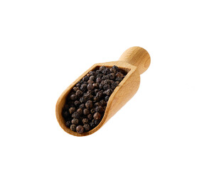 black peppercorns in a wooden serving scoop isolated on white background.