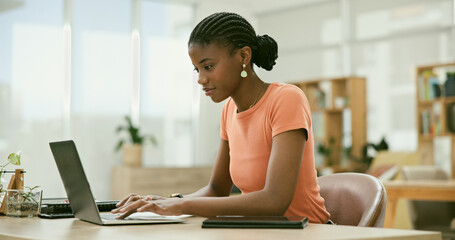 Obraz premium Black woman, typing and laptop for office job, employee and serious for copywriter career. Businesswoman, positive and person for occupation, workplace and worker for company market research