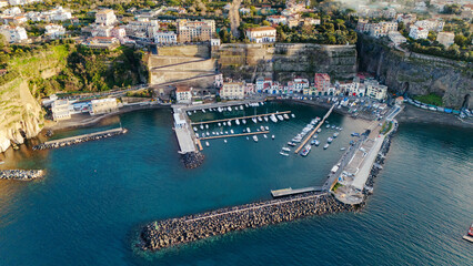 Sorrento Coast. Aerial photo of the Marina di Cassano port in Piano di Sorrento. Characteristic landscape of the city on the cliff overlooking the sea
