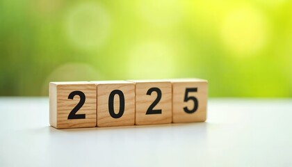 Wooden Blocks Showing 2025 Against a Green Background