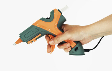 hand holds the glue gun  (identity is global altered PS)