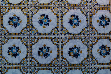Blue, yellow and white floral pattern decorating old Portuguese tiles, present on the facades of several colonial buildings, in the historic center of São Luís, Maranhão, Brazil.