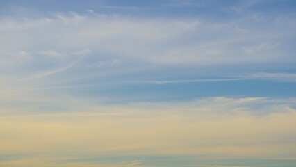 Serene Sunset Sky Pastel Hues and Wispy Clouds