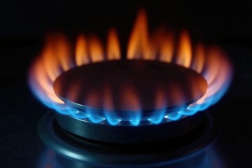 Stove burner flame isolated on a dark background, texture, isolation, kitchen