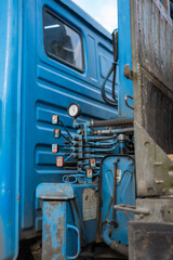 Crane control levers on a blue truck