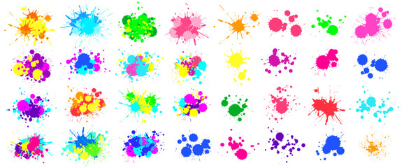 Colorful paint splatters creating a vibrant and artistic mess on a white background, perfect for adding a touch of creativity and energy to any project © Tartila