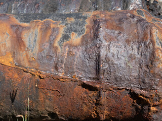 Close-up of an old rusty cannon, corroded rust texture, damaged, effect of sea spray on iron