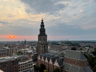 The Martinitoren in Groningen, viewed from the Forum, bathed in the warm glow of a stunning sunset