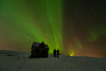 Northern Lights over a snow hut