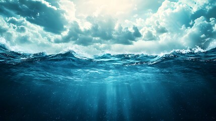 Dramatic moody seascape with powerful ocean waves stormy clouds and sunlight beams piercing through the atmospheric sky