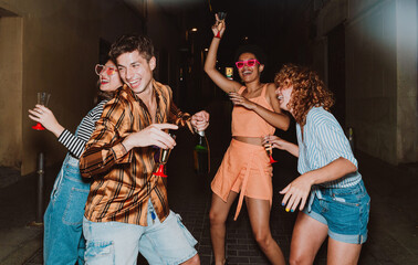 Friends going out in the evening and making party. Young people meeting outdoor in the weekend and...