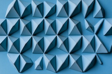 Abstract blue geometric pattern of 3D shapes.