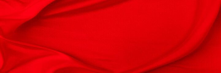 Black red satin dark fabric texture luxurious shiny that is abstract silk cloth background with patterns soft waves blur beautiful.