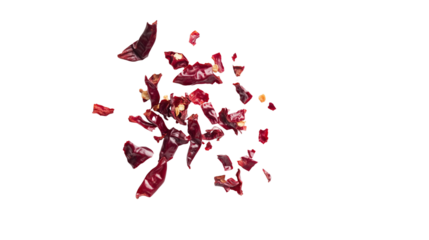  Red chili pepper pieces flying in the air , on  Transparent PNG format background. 
