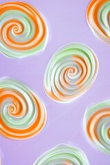 Soft pastel swirls of orange and mint green on a solid lavender background.